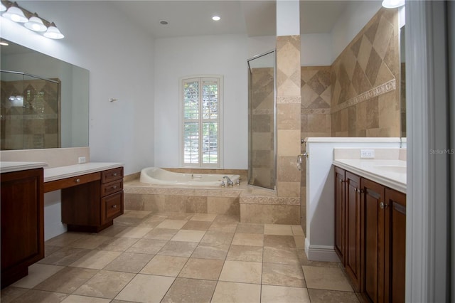 bathroom featuring tile flooring, vanity, and shower with separate bathtub