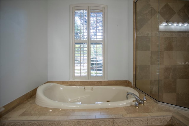 bathroom with tiled bath