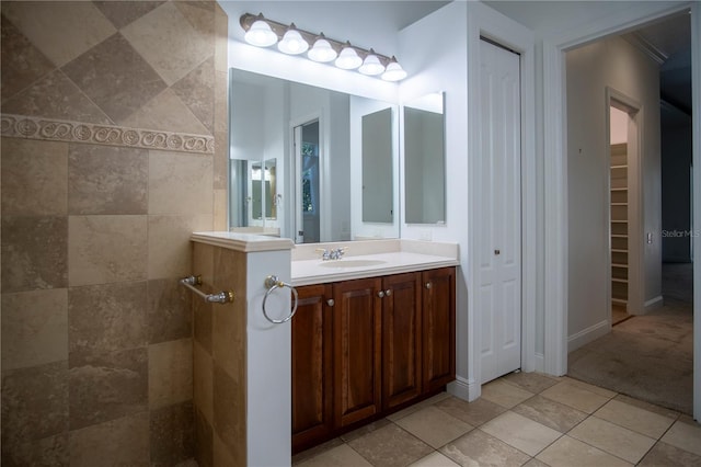 bathroom with vanity with extensive cabinet space and tile flooring