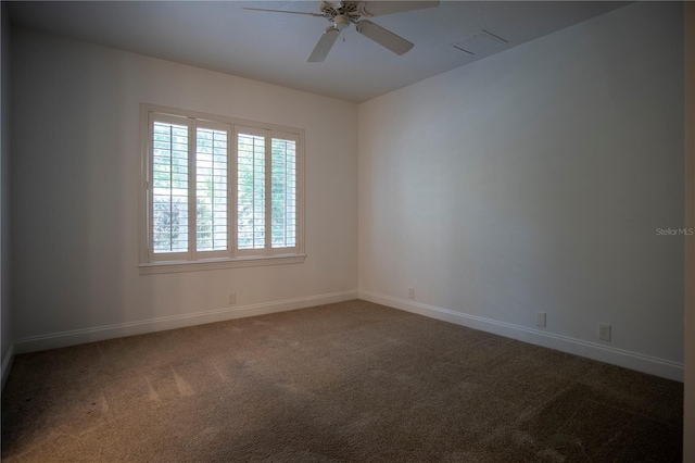 spare room featuring ceiling fan and carpet floors