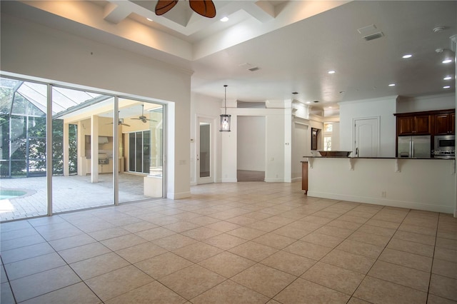 unfurnished living room with ceiling fan, light tile floors, and ornamental molding