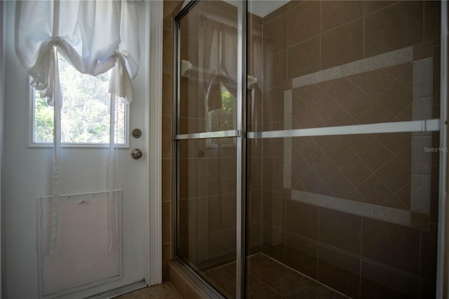 bathroom featuring an enclosed shower