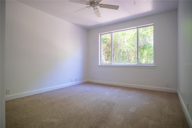 carpeted empty room with ceiling fan