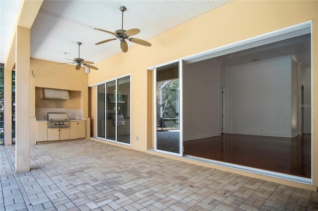 view of patio / terrace featuring ceiling fan and a grill