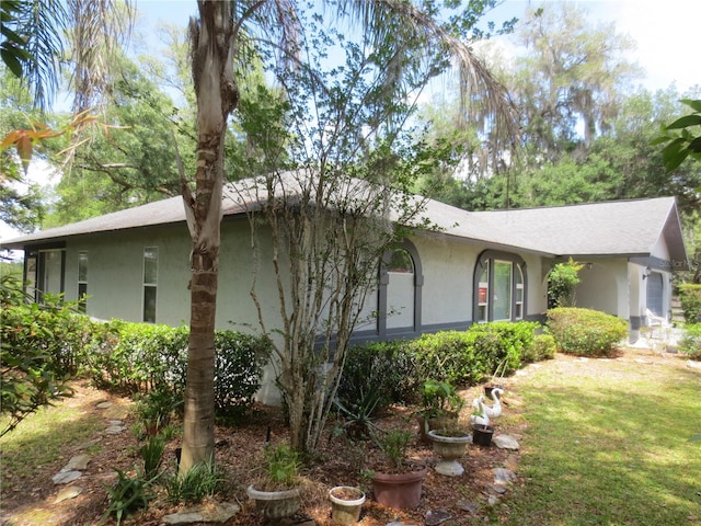 view of home's exterior with a lawn