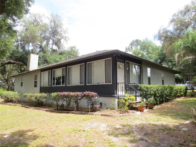 exterior space featuring a front lawn