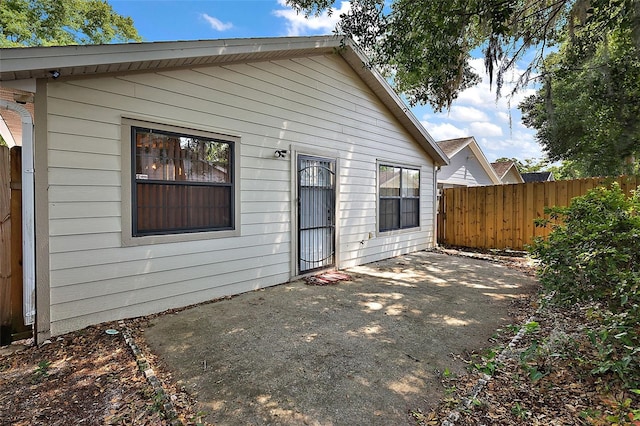 back of property featuring a patio area