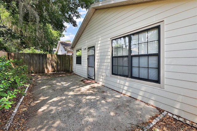 view of side of home featuring a patio area