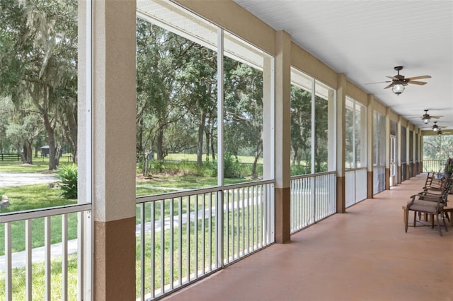 sunroom featuring ceiling fan