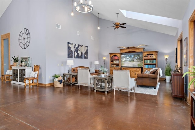 dining space with a skylight, ceiling fan with notable chandelier, and high vaulted ceiling