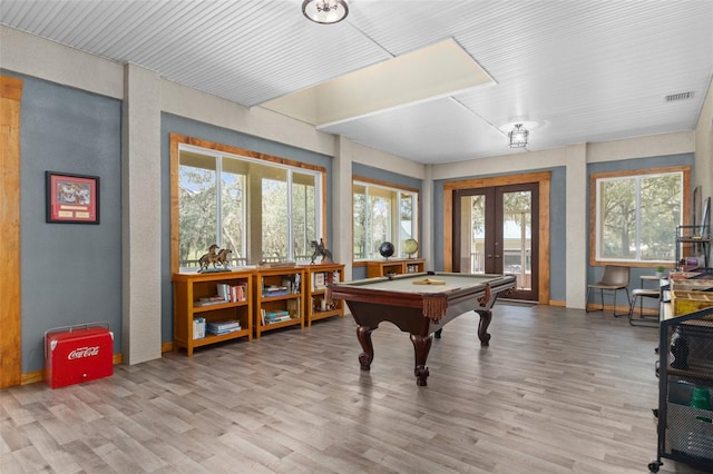 playroom featuring french doors, pool table, and hardwood / wood-style floors