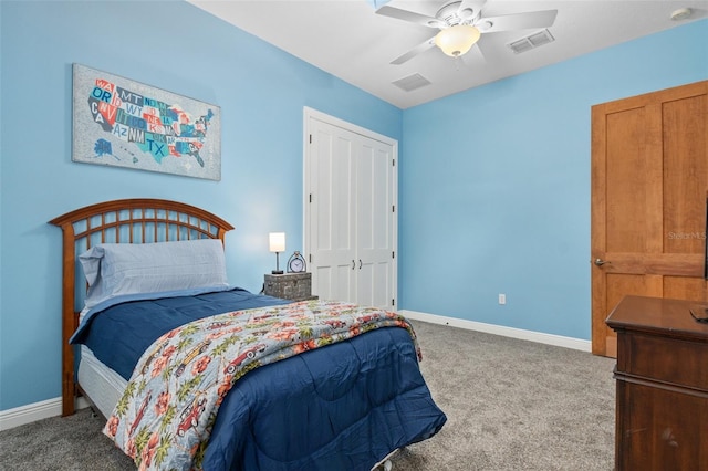 carpeted bedroom featuring a closet and ceiling fan