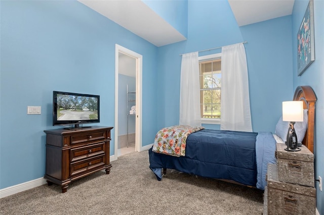 carpeted bedroom featuring connected bathroom