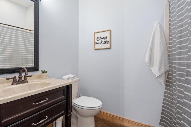 bathroom with toilet and vanity