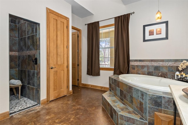 bathroom with concrete flooring, vanity, and separate shower and tub