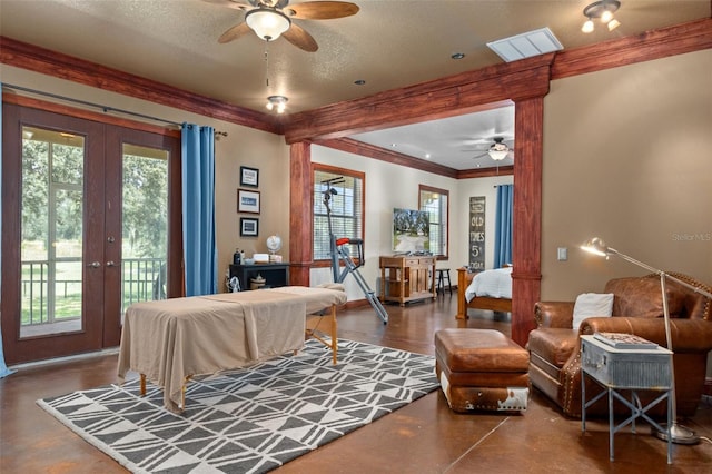 bedroom with multiple windows, french doors, access to exterior, and a textured ceiling