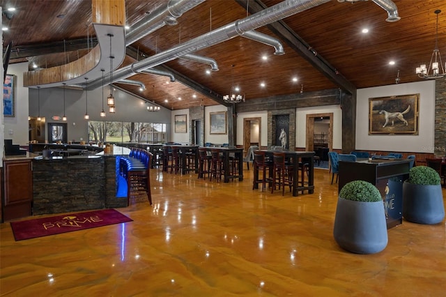 interior space with an inviting chandelier and a towering ceiling