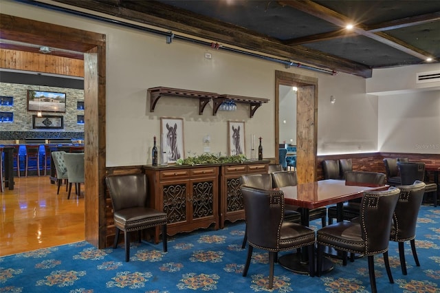 dining room featuring tile flooring and beam ceiling