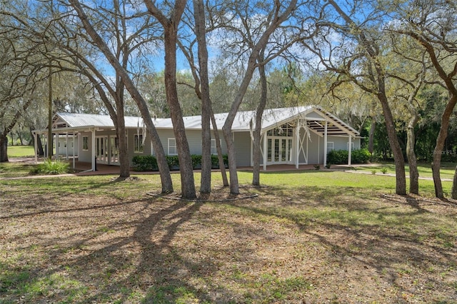 exterior space with a front yard and covered porch