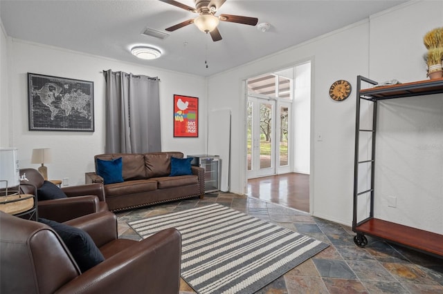 tiled living room featuring ornamental molding, ceiling fan, and french doors