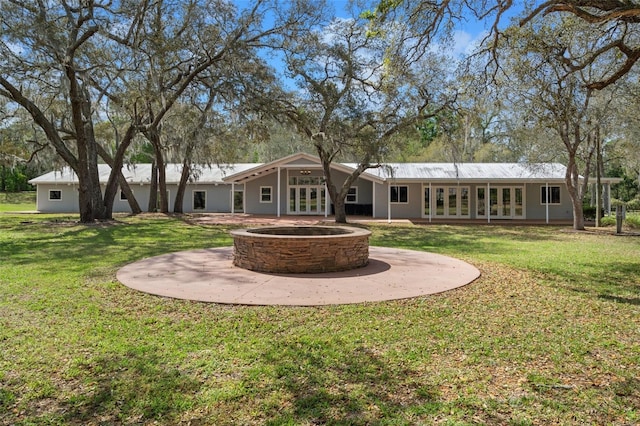 view of yard featuring a fire pit and a patio area