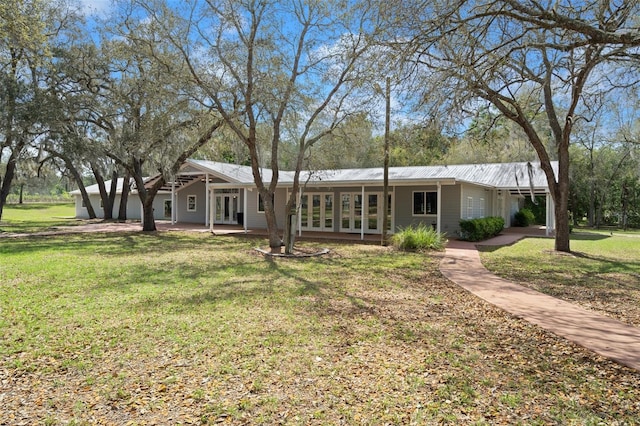 back of house with a yard