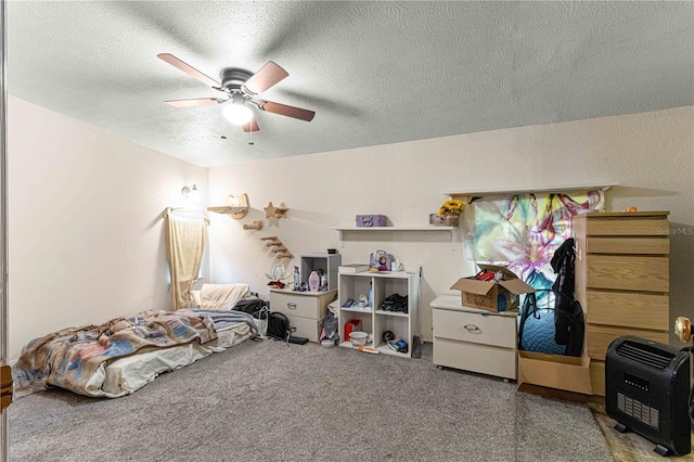 carpeted bedroom featuring a textured ceiling and ceiling fan