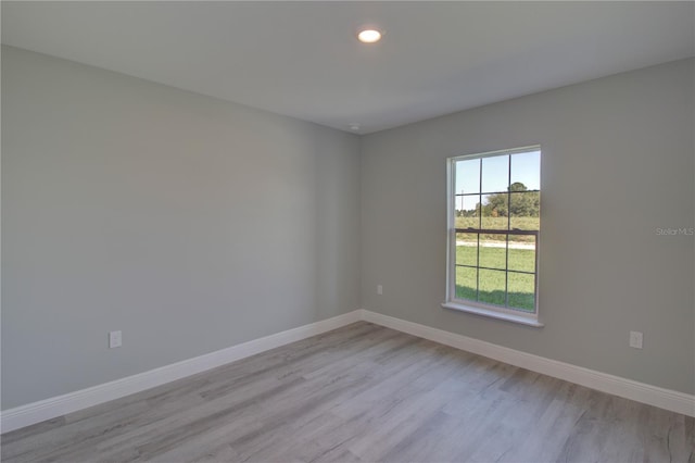 unfurnished room featuring light hardwood / wood-style flooring