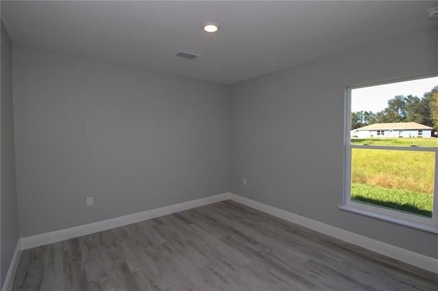 unfurnished room featuring wood-type flooring