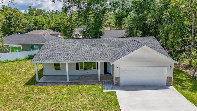 ranch-style house with a front yard and a garage