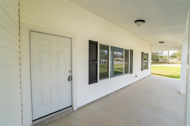 property entrance featuring covered porch