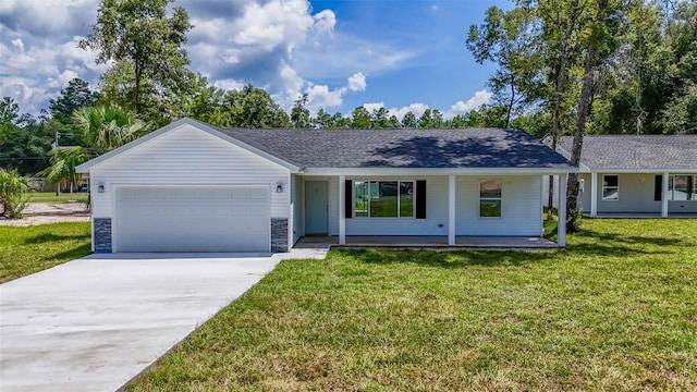 single story home featuring a garage, concrete driveway, stone siding, and a front lawn