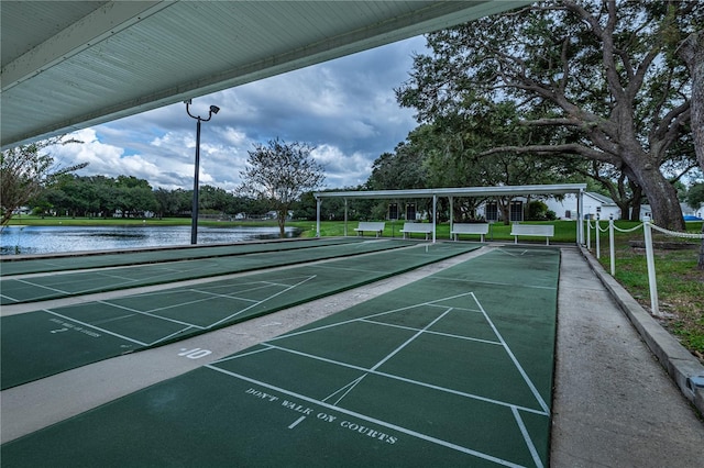 surrounding community featuring a water view