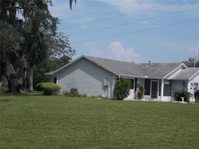 view of property exterior featuring a lawn