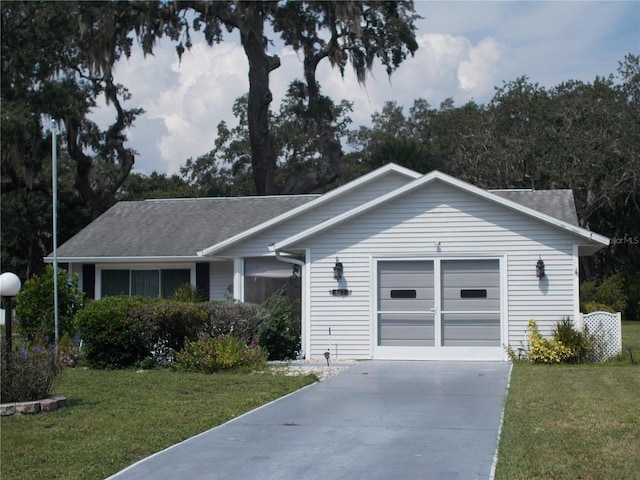 ranch-style home with a front lawn and a garage