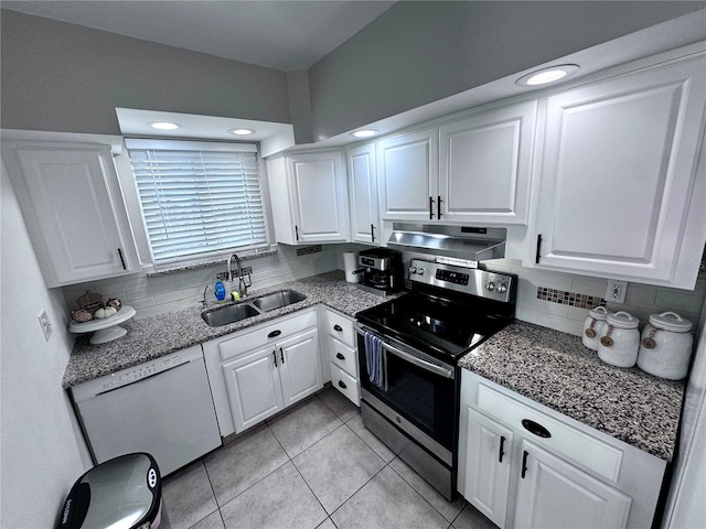 kitchen with light tile patterned floors, white cabinetry, white dishwasher, stainless steel electric range oven, and sink