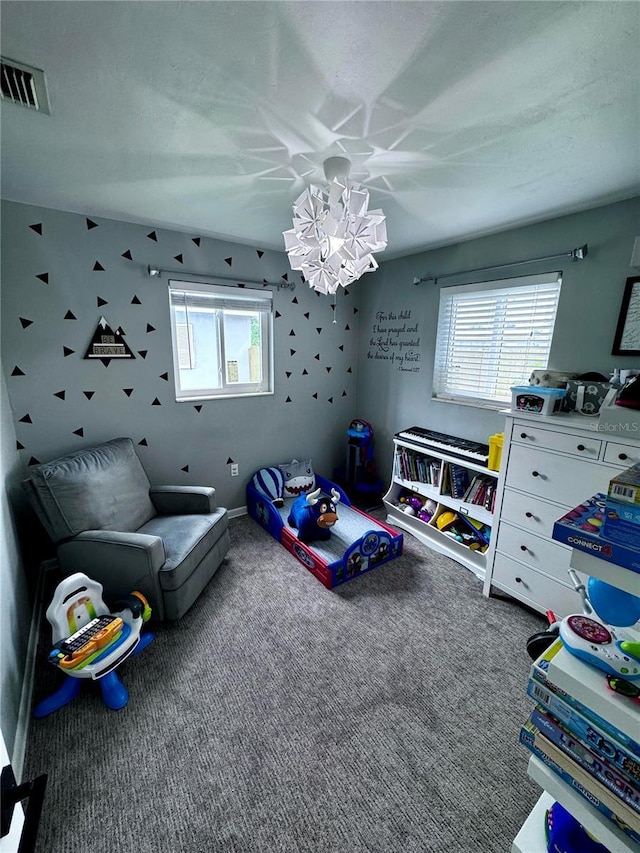 353 Shady Lane Rd, Palm Springs, FL 33461 - rec room featuring a notable chandelier, carpet floors, a healthy amount of sunlight, and visible vents