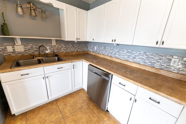 kitchen featuring dishwasher, light tile flooring, tasteful backsplash, white cabinets, and sink