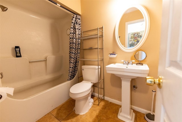 bathroom with tile flooring, shower / bath combination with curtain, and toilet