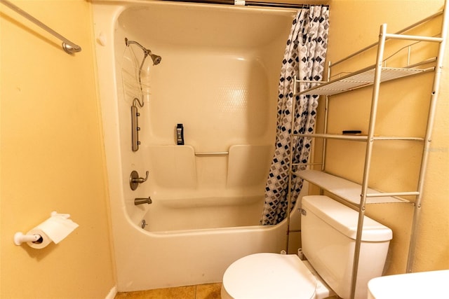 bathroom featuring shower / bath combination with curtain and toilet