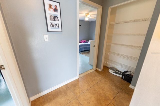 corridor with light tile floors