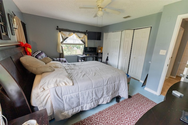 bedroom featuring a closet, ceiling fan, and a textured ceiling