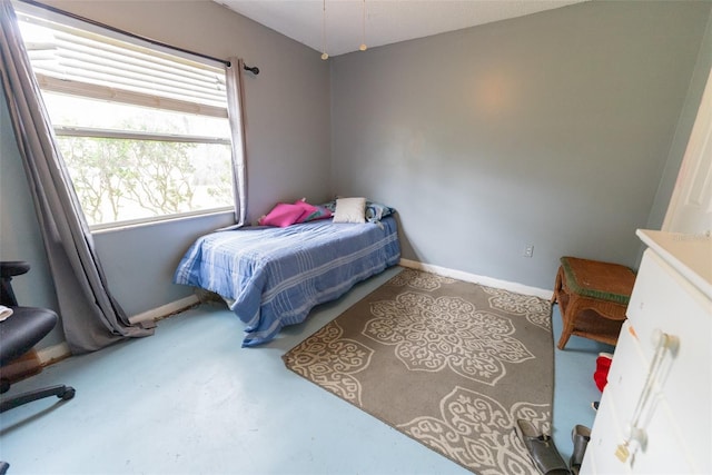 bedroom with concrete floors