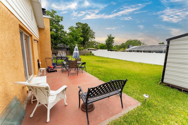 view of terrace featuring a storage unit