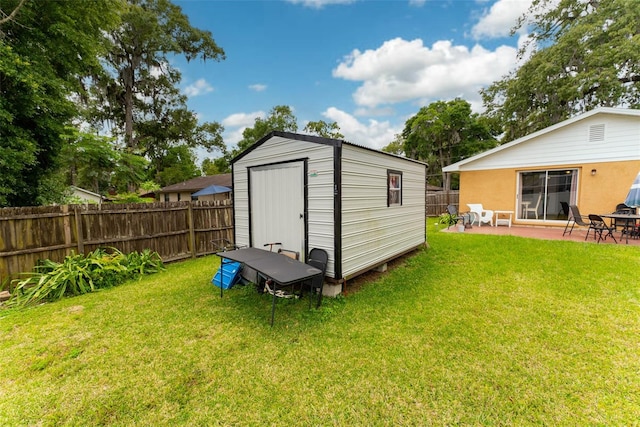 view of shed / structure with a yard