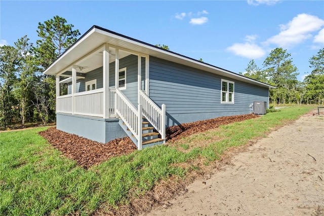 view of property exterior featuring cooling unit and a porch