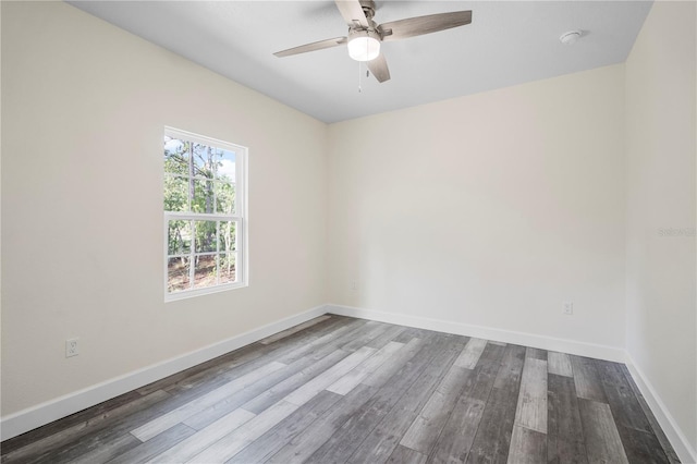 empty room featuring ceiling fan and dark wood-type flooring