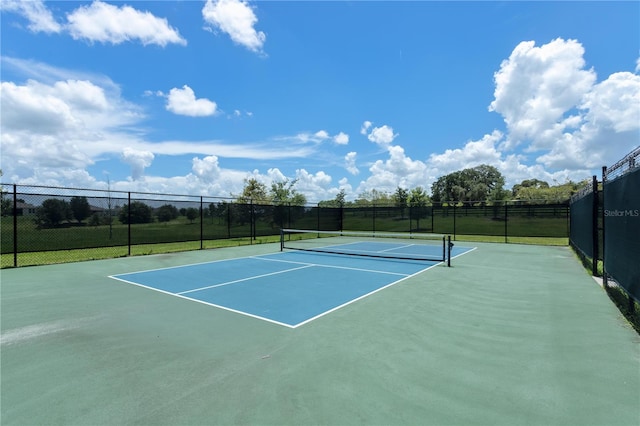 view of sport court with basketball hoop