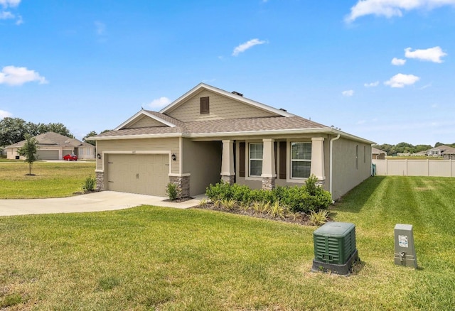 view of front of property featuring a front yard and a garage