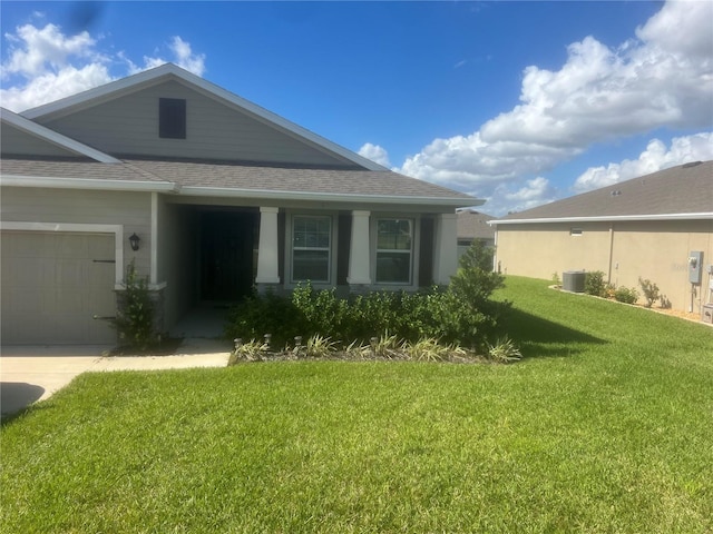 view of property exterior with central AC, a yard, and a garage